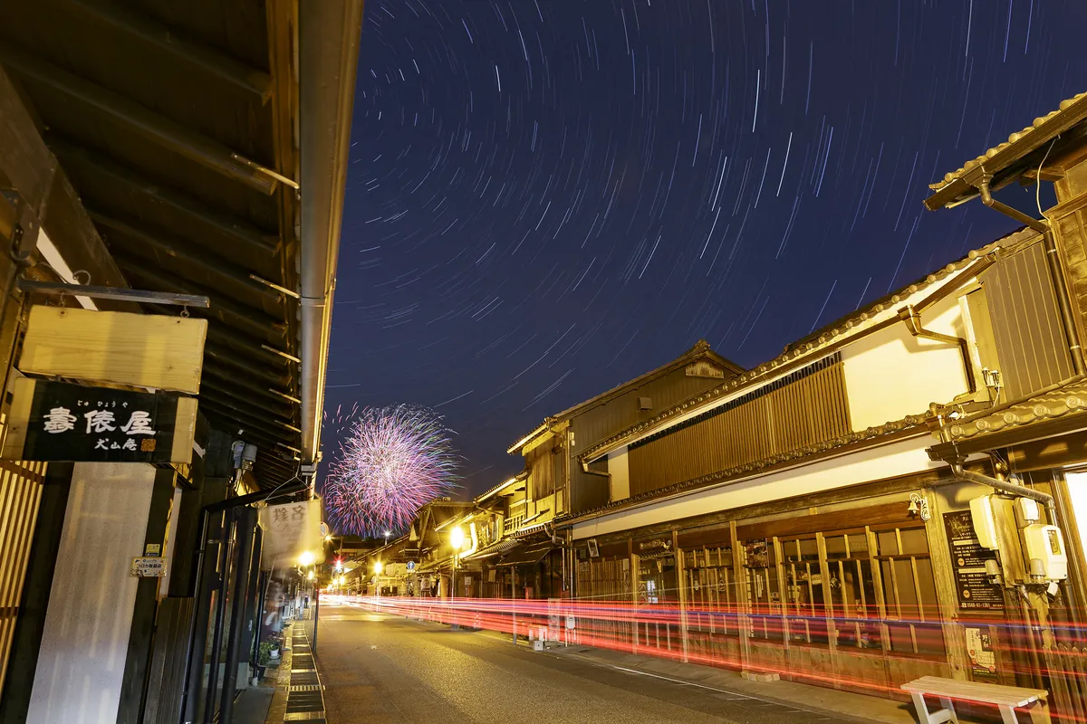 Summer fireworks illuminating the sky above Inuyama castle town and the Kiso River