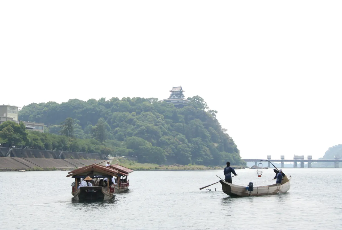 Daytime cormorant fishing demonstration on the Kiso River near Inuyama Castle