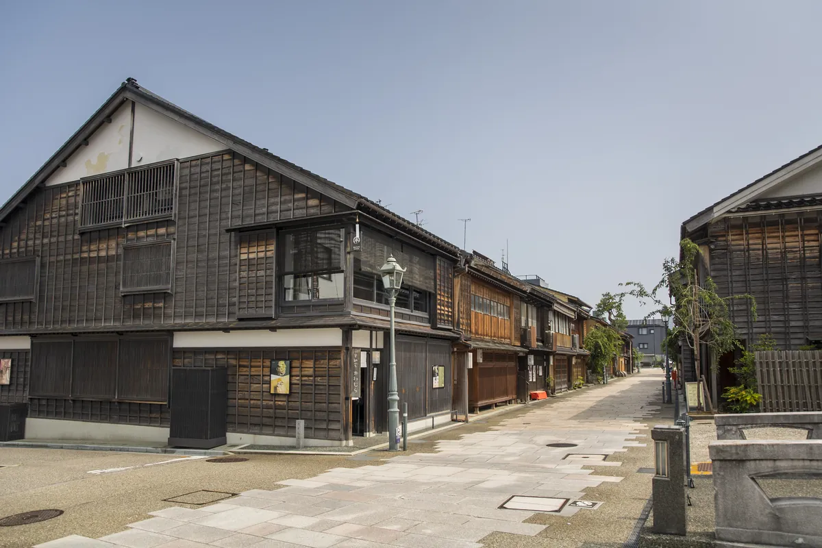 Wooden samurai residences lining a traditional stone-paved street in Nagamachi Samurai District