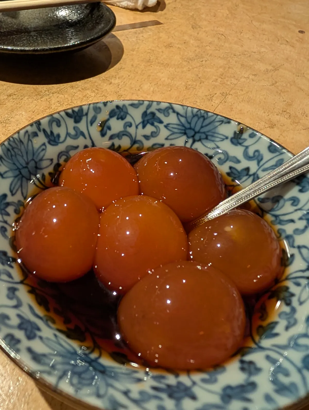 Miso-glazed dango rice dumplings in a decorative bowl — a traditional Nagoya sweet