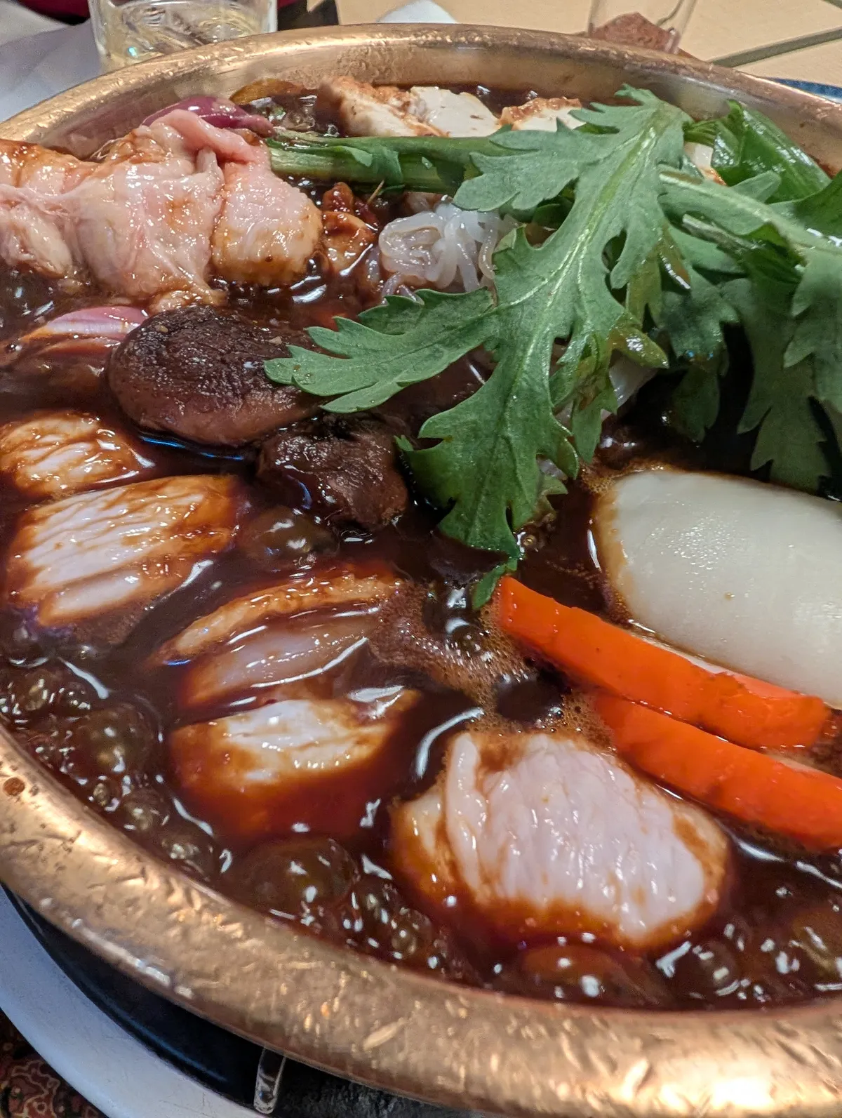 Tori no miso nabe with chicken, vegetables, and meatballs in rich dark miso broth