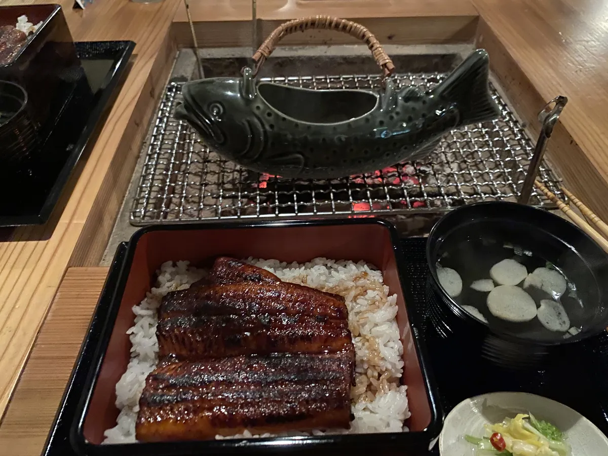 A traditional unaju lacquerware box with glazed grilled eel over rice in Nagoya