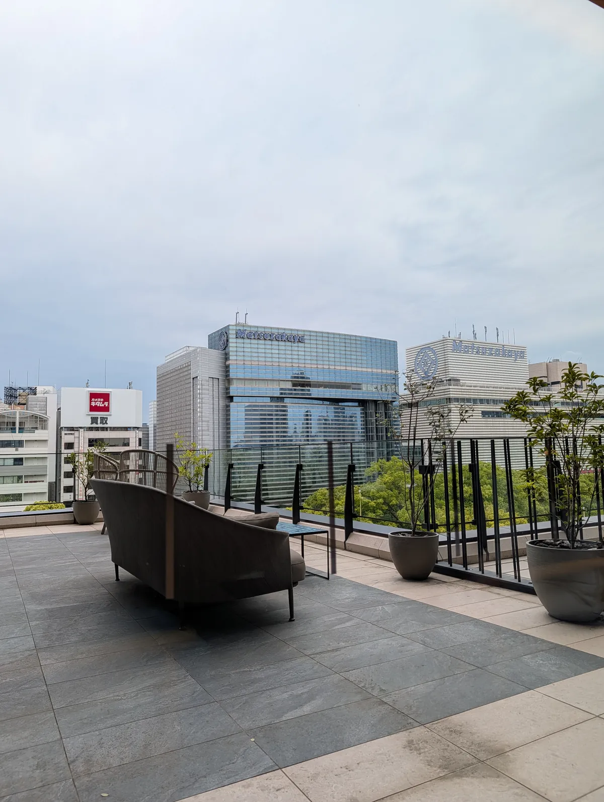 TIAD Autograph Collection rooftop terrace looking out toward Matsuzakaya department store in central Nagoya during the day